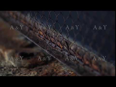 The fence mesh is covered with rust. Corrosion of metal.