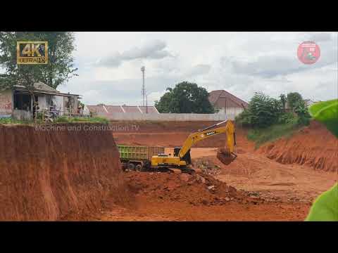 nice work! sany excavator loading dirt into truk from the deep excavation area