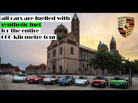 seven 911 cars from different years through Rhineland