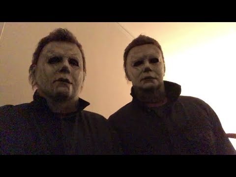 Nick Castle and James Jude Courtney wearing their Michael Myers masks and coveralls