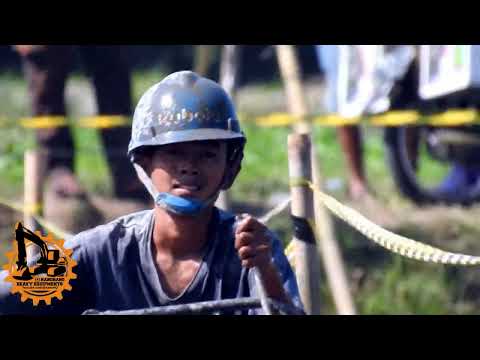 Kids as a jockey in a hand tractor race on a ricefields