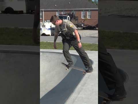 On Duty Cop Skateboarding In Uniform