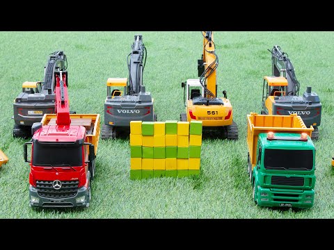 Volvo Excavator vs CAT Excavator Fight Who Will Win RC excavators and dump trucks roam the grass