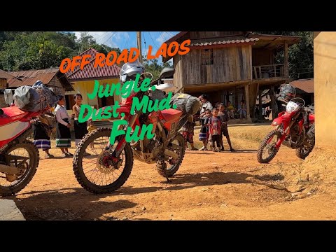 Off road in Laos. Dust, Mud and 'Potholes' you could bury a sheep in....