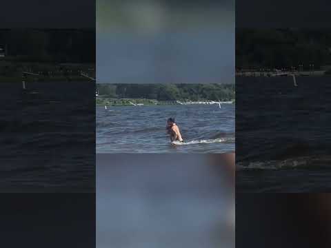 Fake Shark Fin Prank Startles Beachgoers!