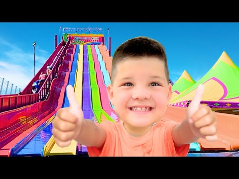 FIRST ROLLER COASTER RIDE at FUN FAIR! CALEB RIDES OUTDOOR AMUSEMENT PARK RIDES for KIDS with DAD!