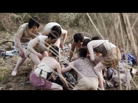 The bandits saw a group of female soldiers playing by the river and rushed up