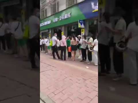 Queues outside hospital for vaccinations in Guangzhou City, China • See .... | China Real Footage