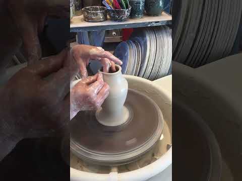 Throwing a vase on the pottery wheel.