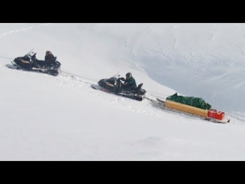 Snowmobiles stuck on a snowy slope - Barnes Icecap expedition - 2012