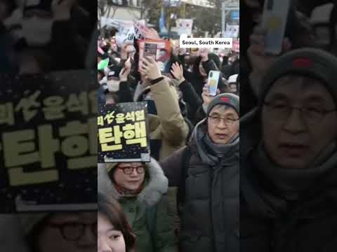 Protestors celebrate South Korean President Yoon's impeachment